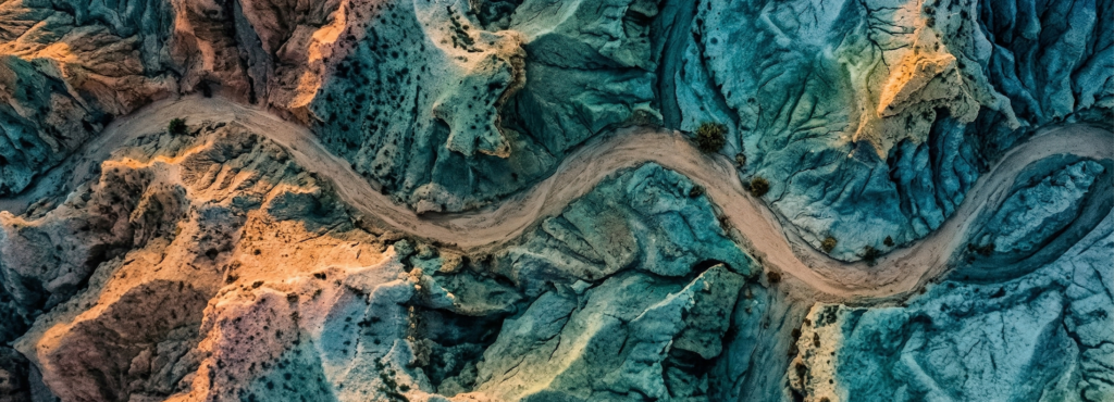 Aerial terrain landscape representing the complex path of enterprise AI adoption